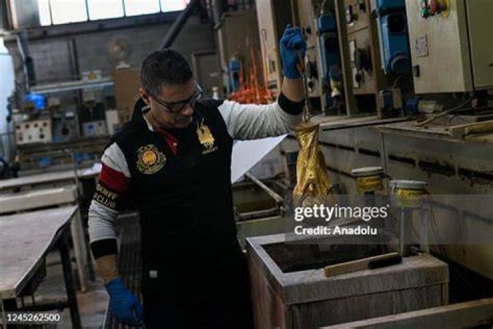 A GDE Bertoni worker works on the replica trophy