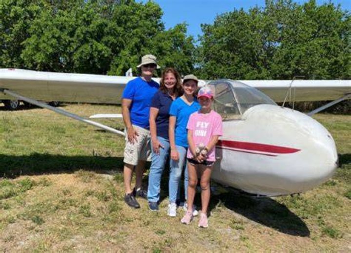 Aileen Watkins and her daughter, Katalin, at home at Naked Lady Ranch in Palm City with the family plane, a 1946 Piper Cub J-3. Photo by Steven Martine