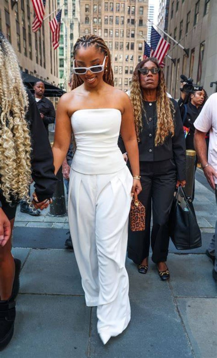 An all-white ensemble for their performance
