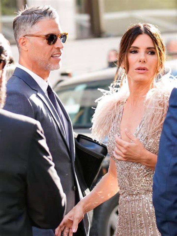 Bryan Randall - pictured here with Sandra Bullock's kids - passed away on August 5 after a three-year battle with ALS
