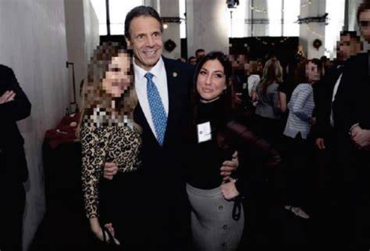 Cuomo with the witness listed as 'Executive Assistant #1' and Alyssa McGrath at a holiday party