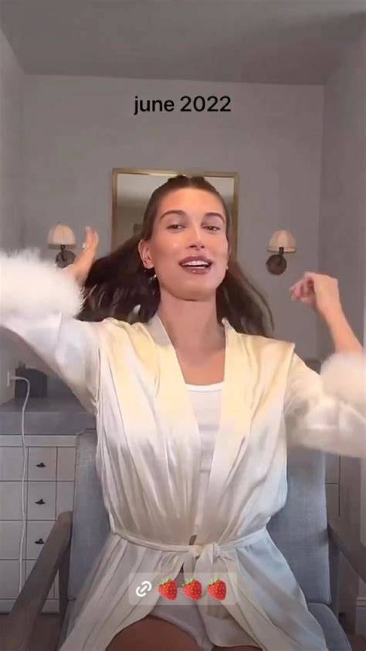 Hailey sported a white fur coat without a top underneath