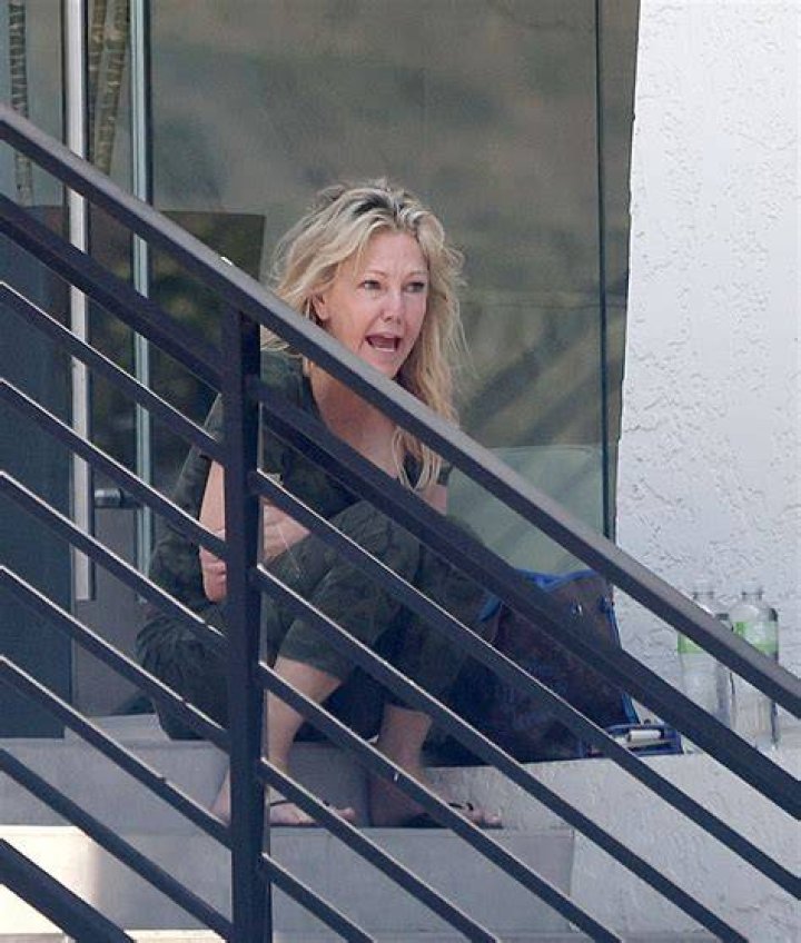 Heather, pictured teetering on ledge in California last week, has suffered a devastating 17-year battle with booze