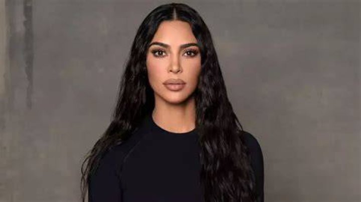 Kim Kardashian posed in a skintight nude bodysuit while promoting a free $10,000 giveaway