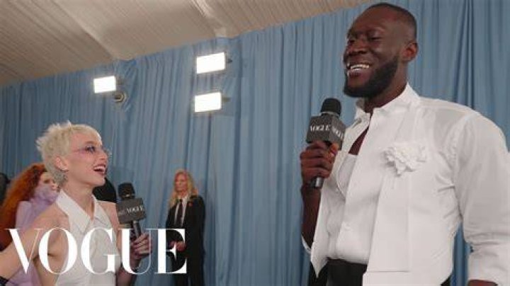 (L to R) Stormzy, Emma Watson and Ncuti Gatwa posed together in the Evian VIP Suite