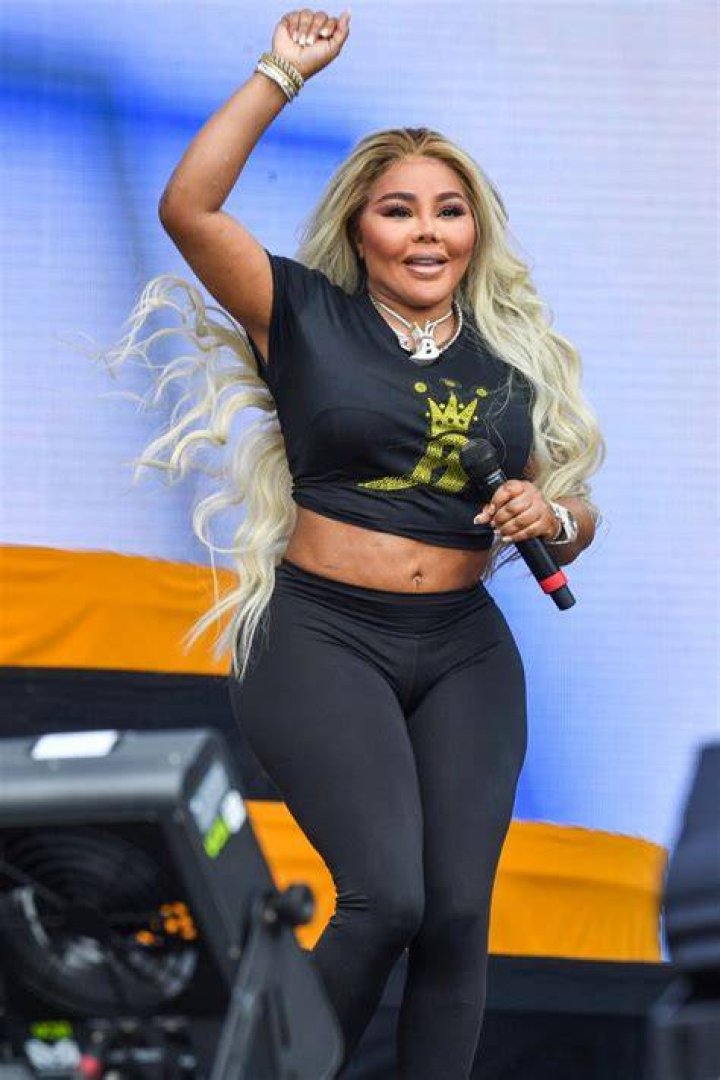 Lil&rsquo; Kim Performs in Crop Top & Knit Sneakers at Lovers & Friends Footwear News