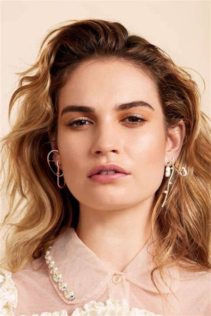 Lily James cheered from the stands as she got involved in the Centre Court action