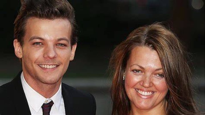 Louis Tomlinson and Johannah Deakin attend the Believe in Magic Cinderella Ball at Natural History Museum on August 10, 2015 in London, England.