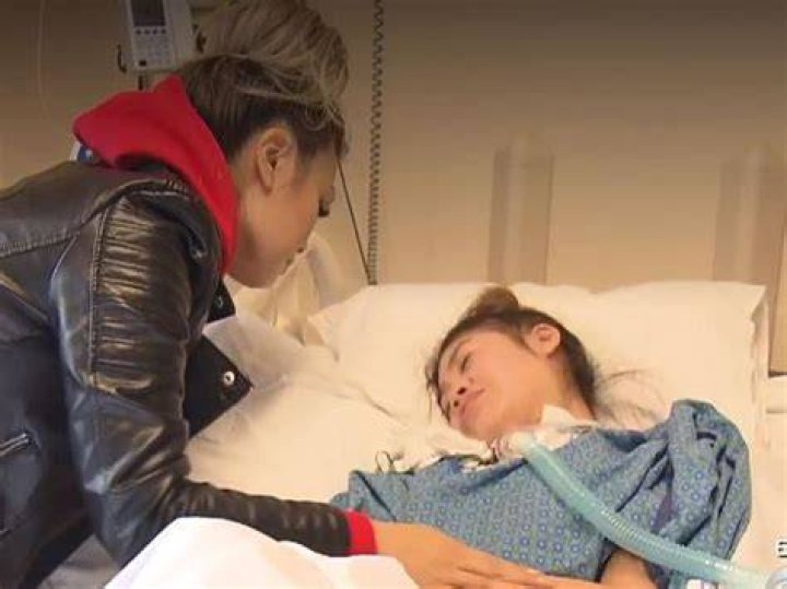 Lynn Fam visits her daughter at the hospital daily to brush her hair and fluff her pillows