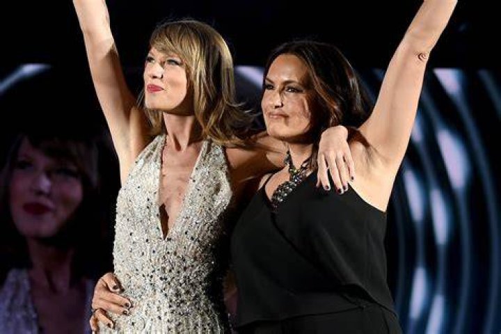 Mariska Hargitay and Taylor Swift pose on stage during the '1989' world tour at Lincoln Financial Field in Philadelphia on June 12, 2015.