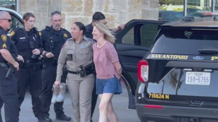 Police have detained a woman for questioning regarding the shooting at the Atlanta school