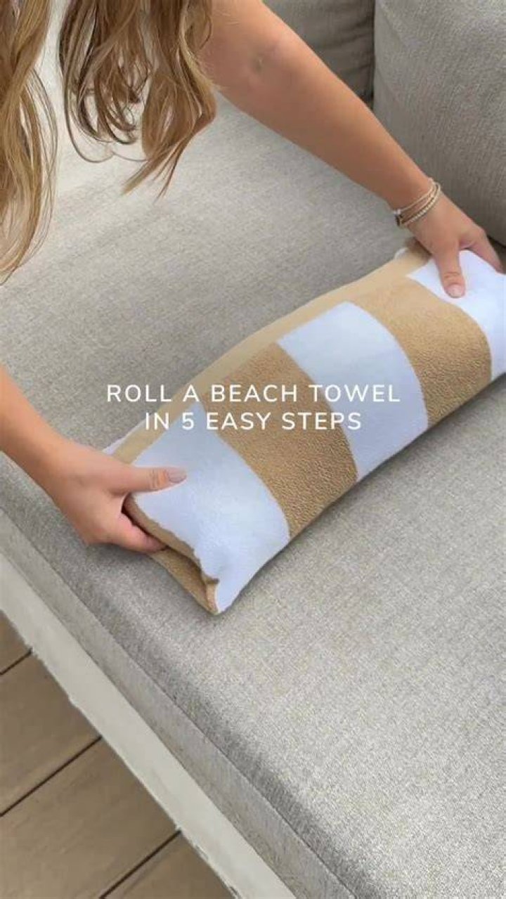 Rolling your towel up rather than tucking it to the side creates a seal that will stop it from falling