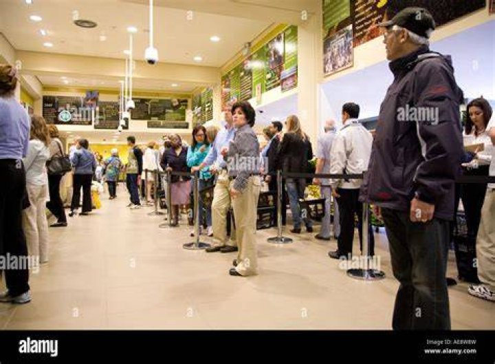 Shoppers are seen queuing up on Friday in Massachusetts