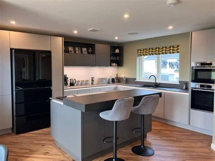 The kitchen initially had gray cabinets and countertops