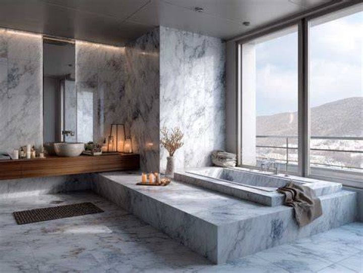 The main bathroom has marble countertops and floors