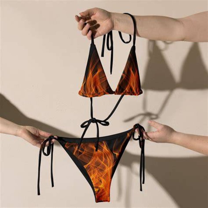 The micro bikini sported flames on it