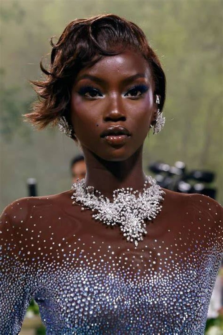 The model sparkled on a glam night out after walking in Paris Fashion Week, and took plenty of snapshots of her high-fashion look