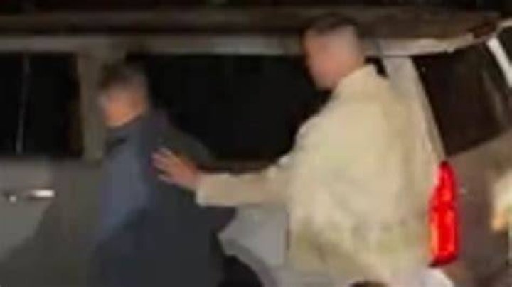 Travis placed his hands below Kourtney's boobs