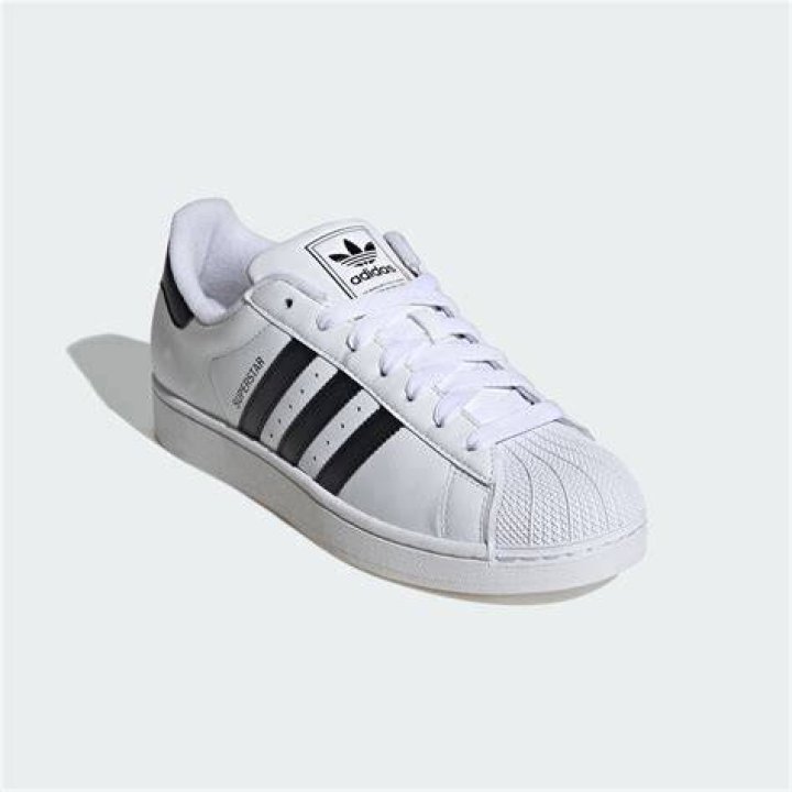 white Adidas sneakers
